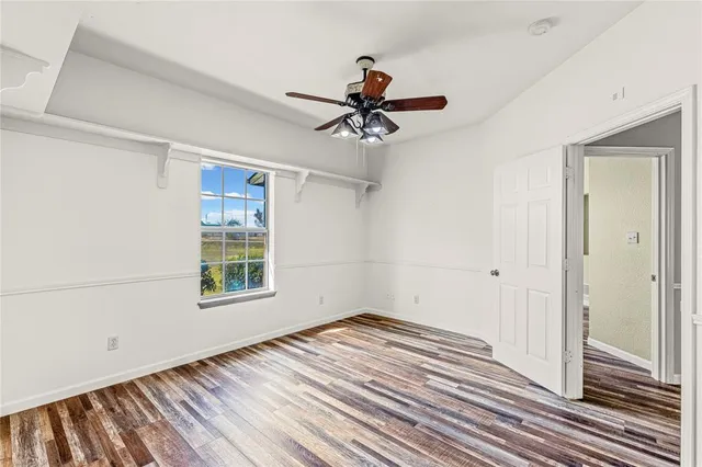 a bedroom with double bed and a chandelier