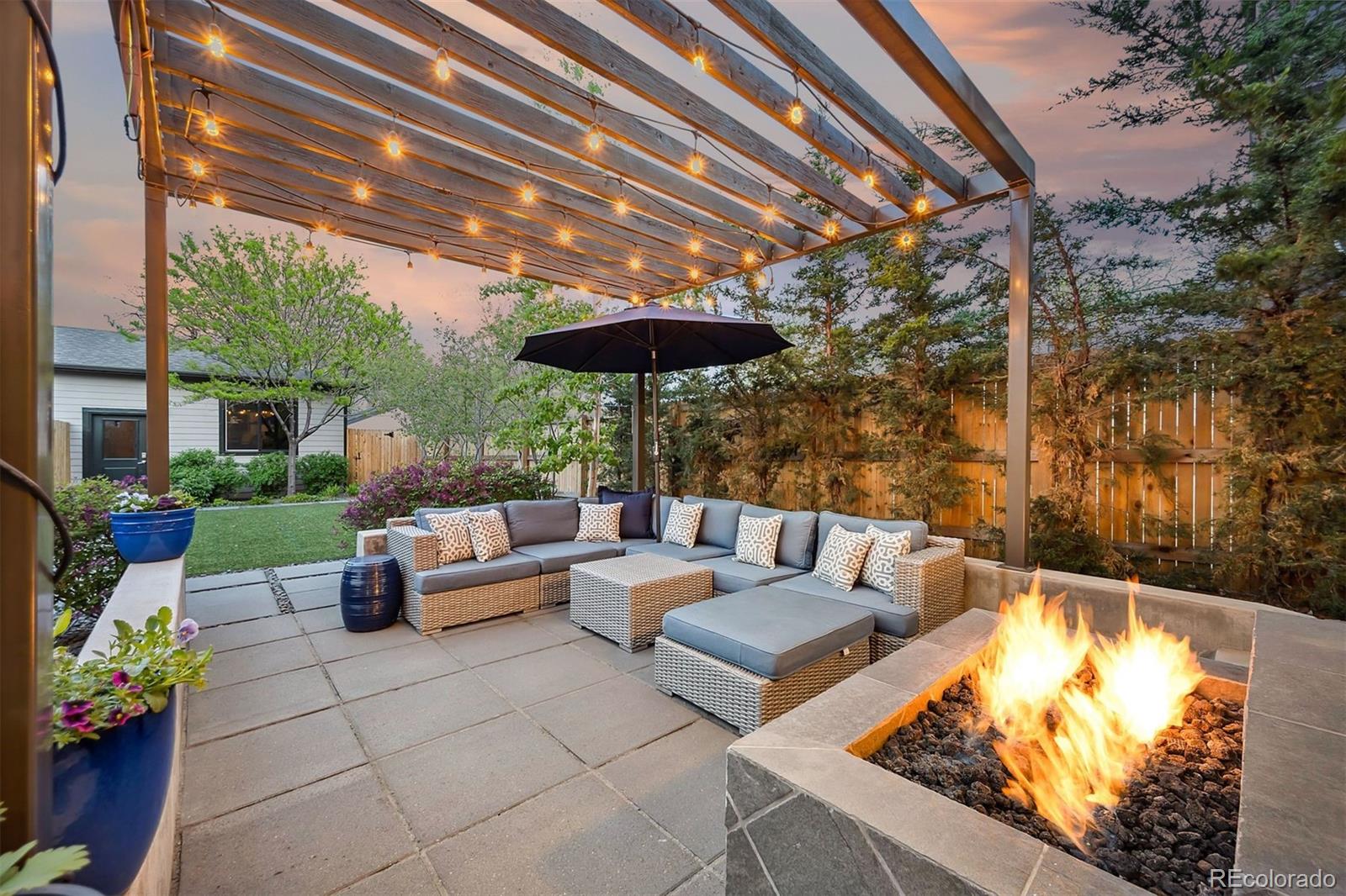 3536 Tejon Street Denver, CO 80211 - Photo 1 of 33 a view of an outdoor sitting area with furniture and umbrella