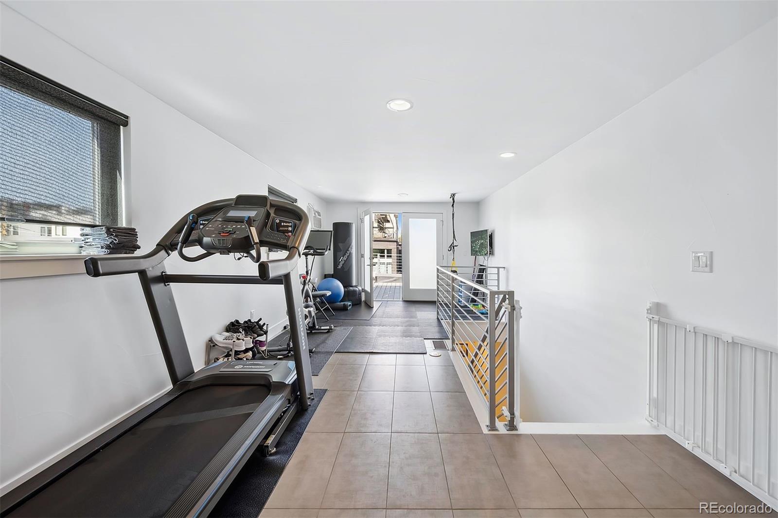 3536 Tejon Street Denver, CO 80211 - Photo 18 of 33 a view of a hallway with a dining table & chairs