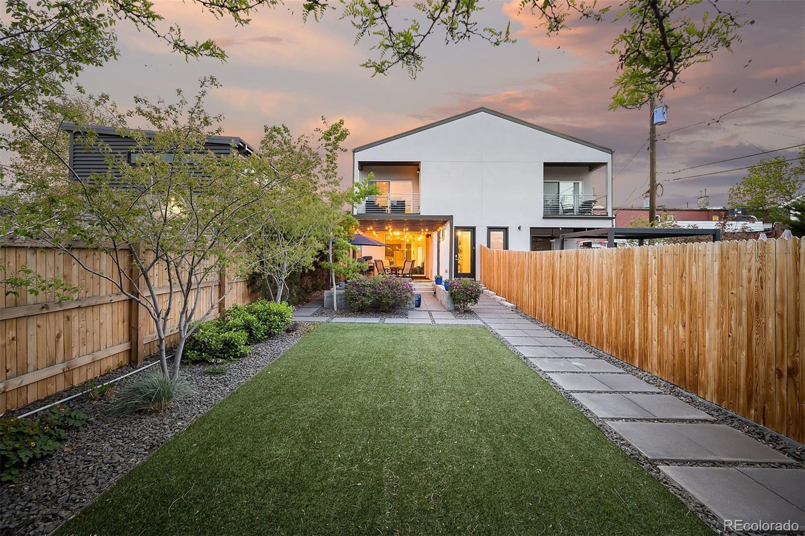 3536 Tejon Street Denver, CO 80211 - Photo 2 of 33 a front view of a house with yard and green space