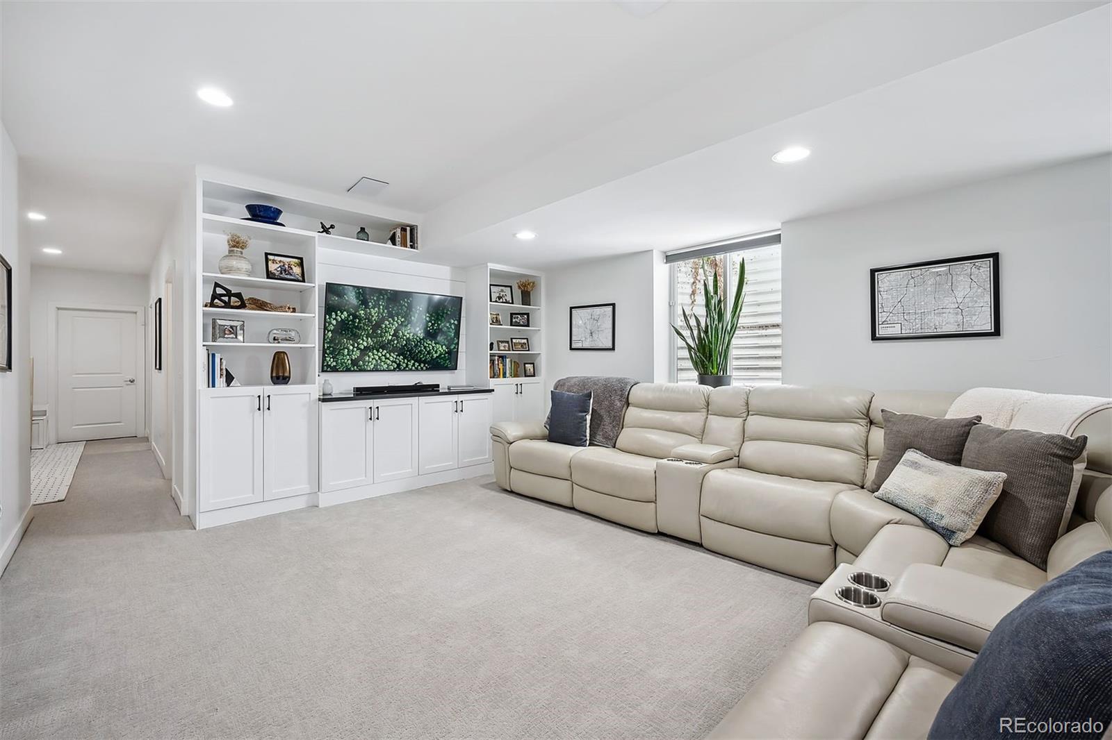 3536 Tejon Street Denver, CO 80211 - Photo 21 of 33 a living room with furniture and a flat screen tv