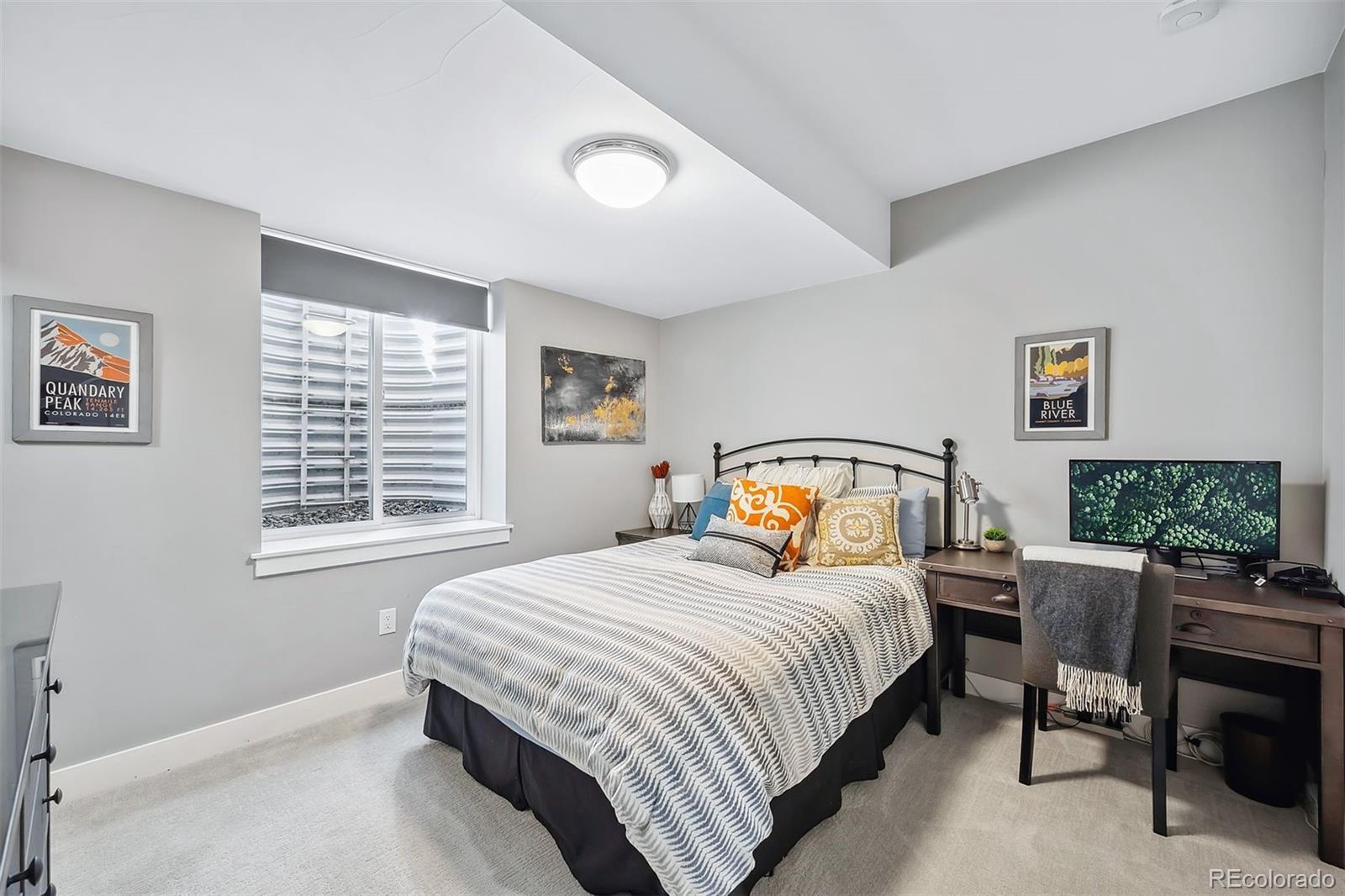 3536 Tejon Street Denver, CO 80211 - Photo 24 of 33 a bedroom with a bed and a window
