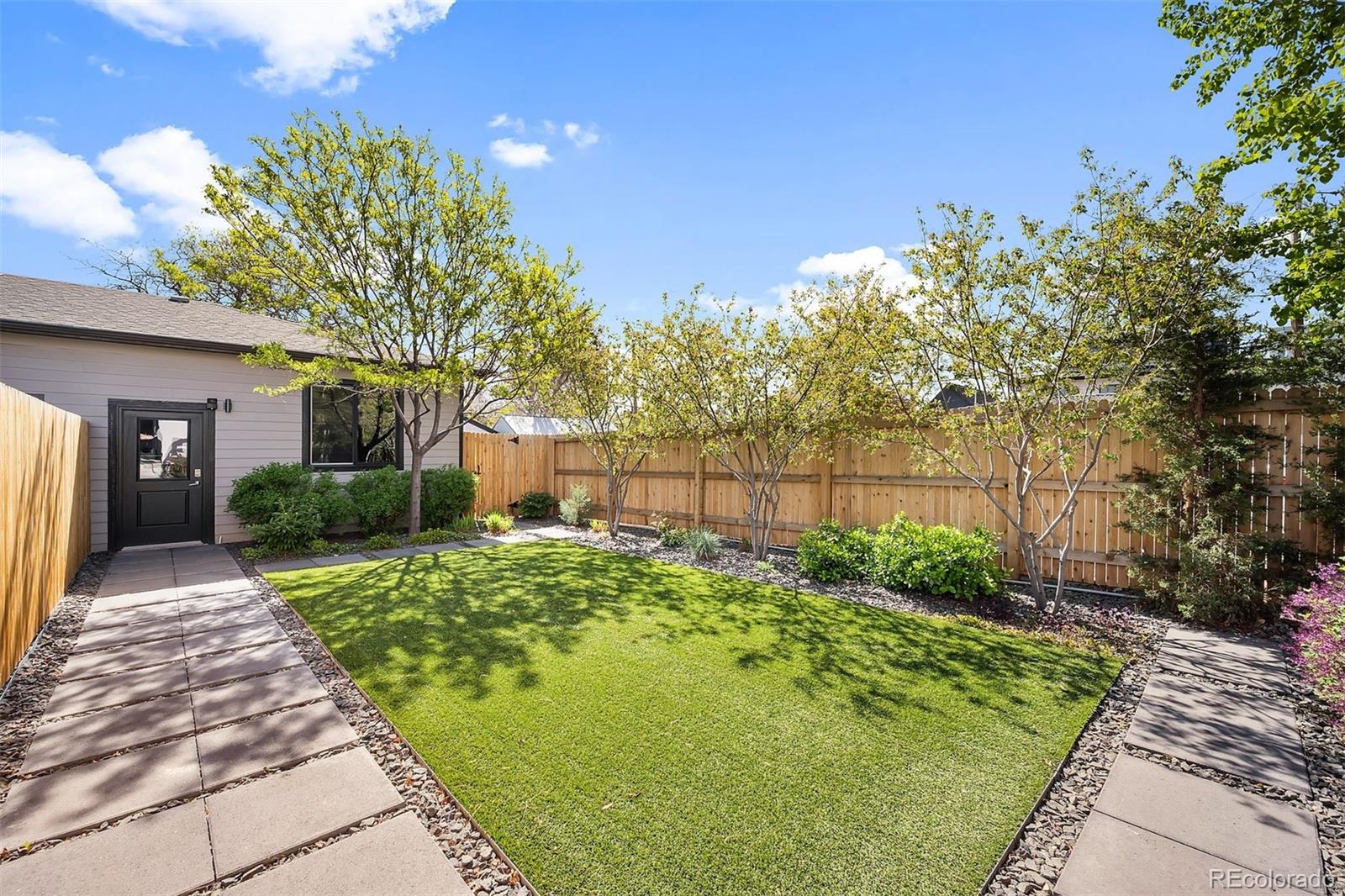 3536 Tejon Street Denver, CO 80211 - Photo 29 of 33 a front view of a house with garden
