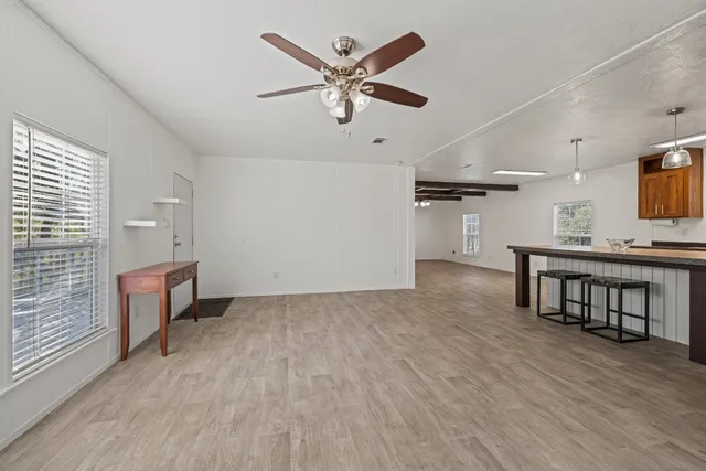 a livingroom with furniture and window