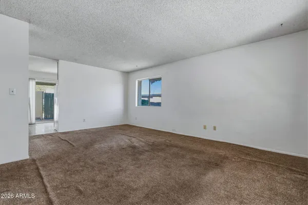 a view of an empty room and window