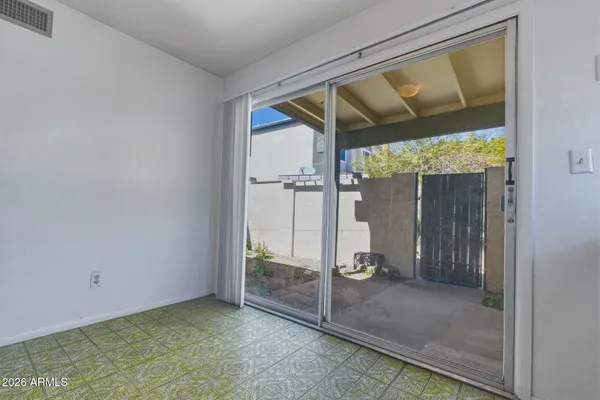 a view of an empty room with a window
