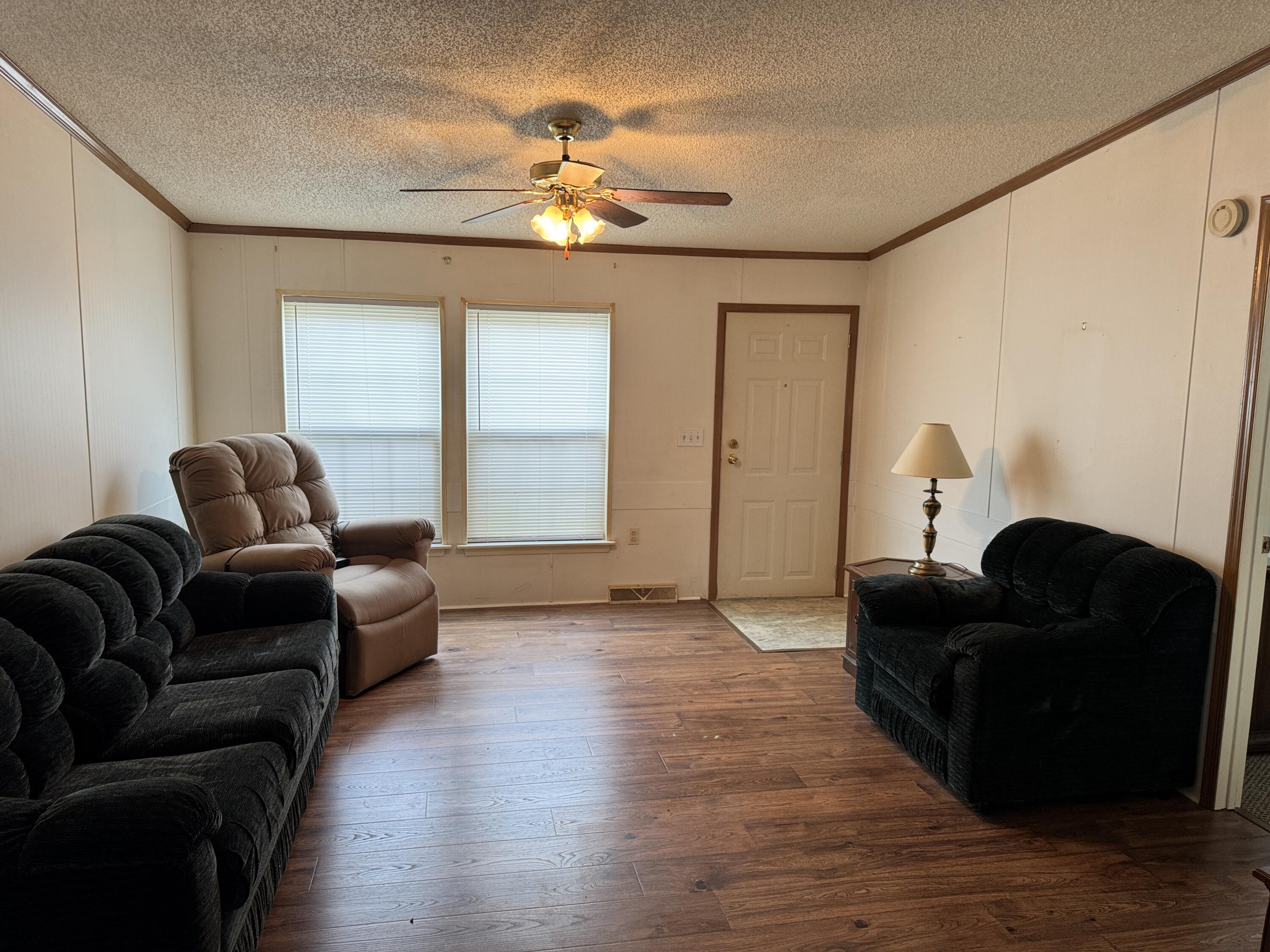 480 Glade Creek Road Glade Hill, VA 24092 - Photo 5 of 14 a living room with furniture and a chandelier