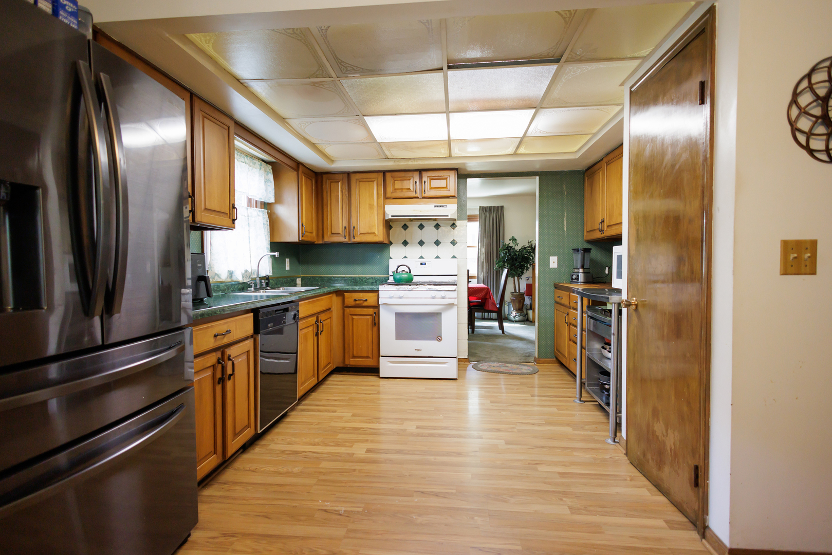 824 South McKinley Avenue Kankakee, IL 60901 - Photo 13 of 58 a kitchen with stainless steel appliances granite countertop a refrigerator a stove and a sink