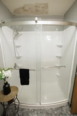 a living room with furniture a window and a flat screen tv