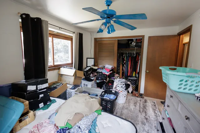 a bedroom with a bed and a dresser