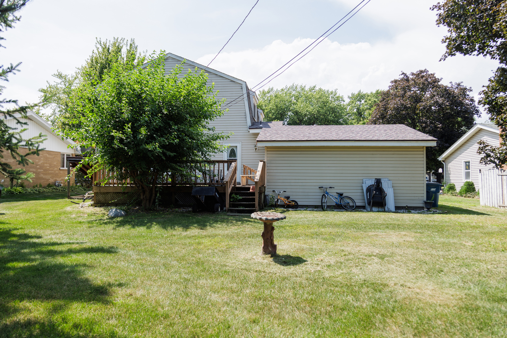824 South McKinley Avenue Kankakee, IL 60901 - Photo 49 of 58 a view of a house with a yard and garage
