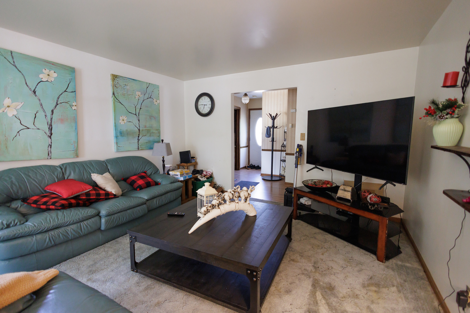 824 South McKinley Avenue Kankakee, IL 60901 - Photo 6 of 58 a living room with furniture and a flat screen tv