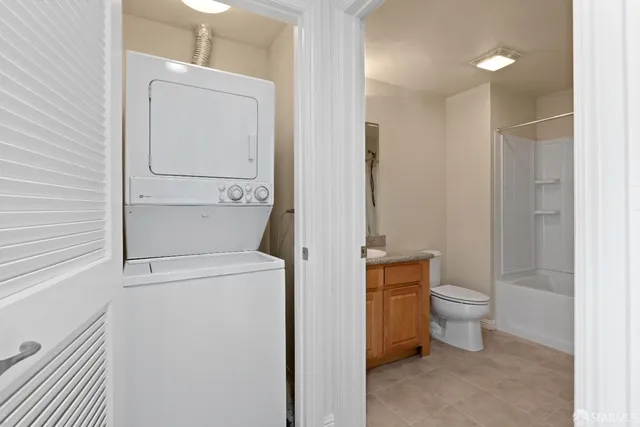 a bathroom with a toilet sink and tub