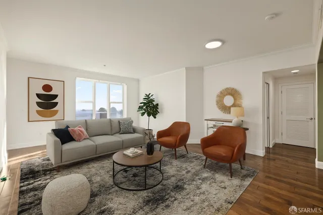 a living room with furniture a rug and a window