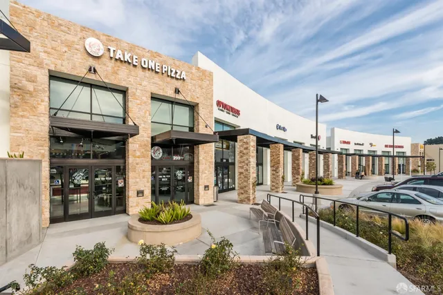 a view of a chairs and table in a patio