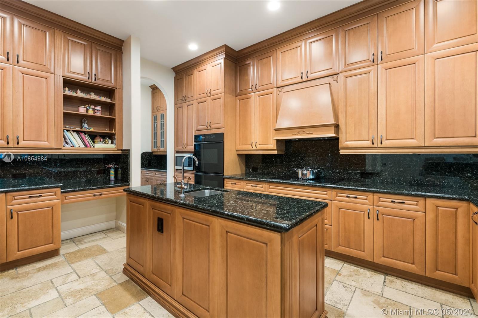 1475 Commodore Way Hollywood, FL 33019 - Photo 11 of 49 a kitchen with stainless steel appliances granite countertop a sink stove and cabinets