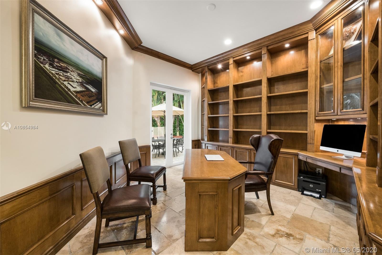 1475 Commodore Way Hollywood, FL 33019 - Photo 15 of 49 a view of a workspace with furniture and a potted plant
