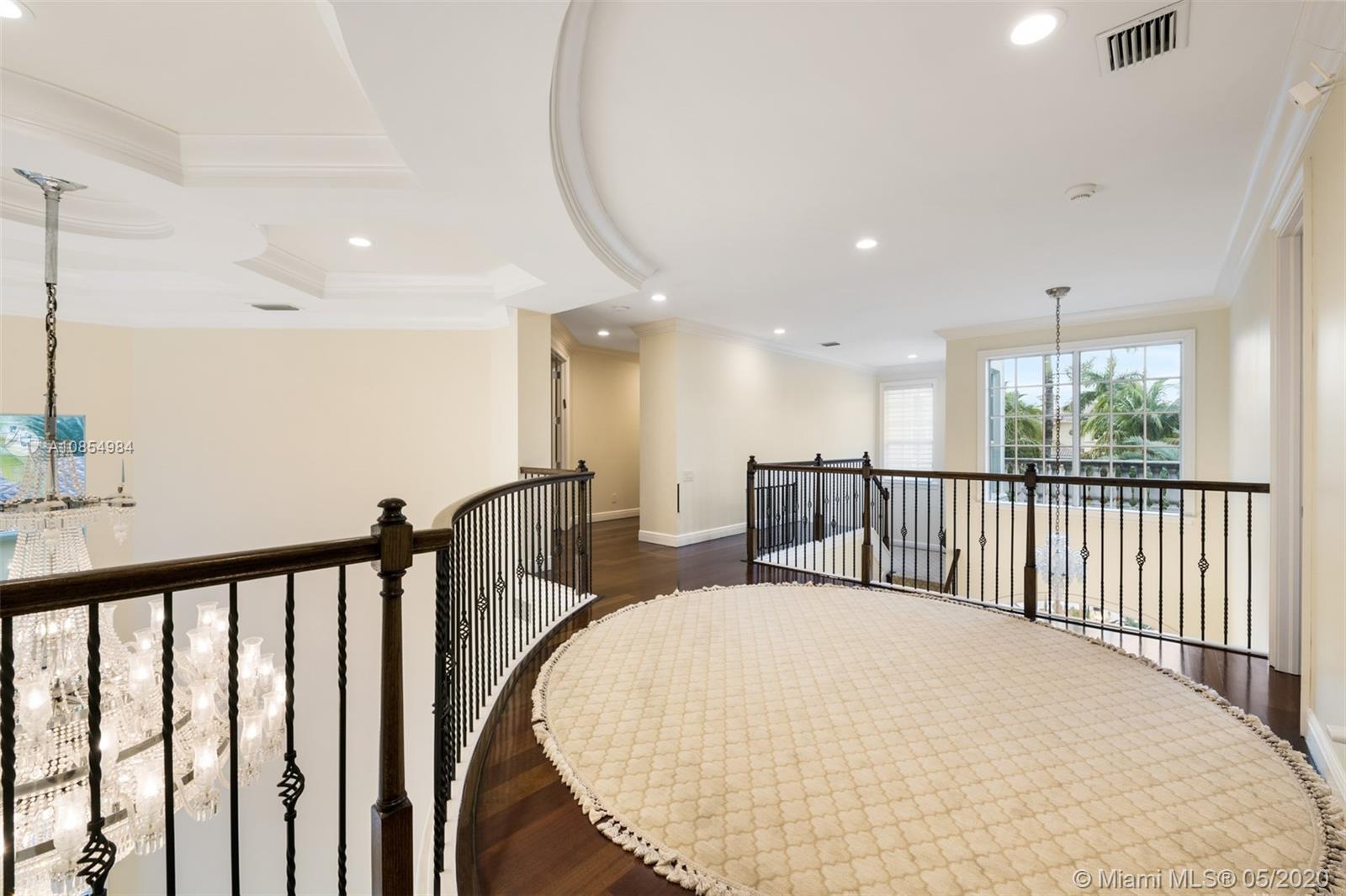 1475 Commodore Way Hollywood, FL 33019 - Photo 19 of 49 a view of a hallway with a large window and wooden floor