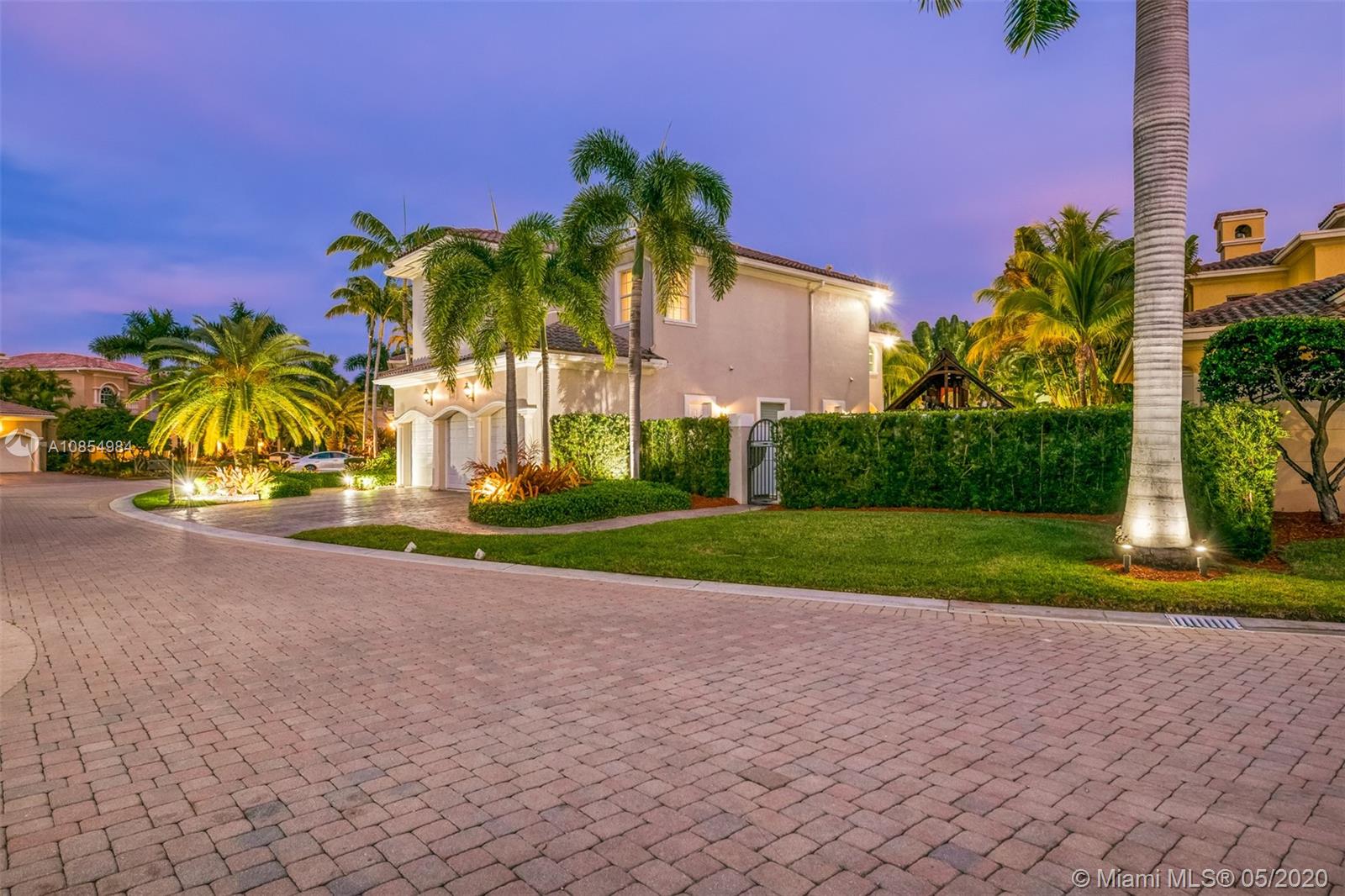 1475 Commodore Way Hollywood, FL 33019 - Photo 2 of 49 a view of a house with a yard and palm trees