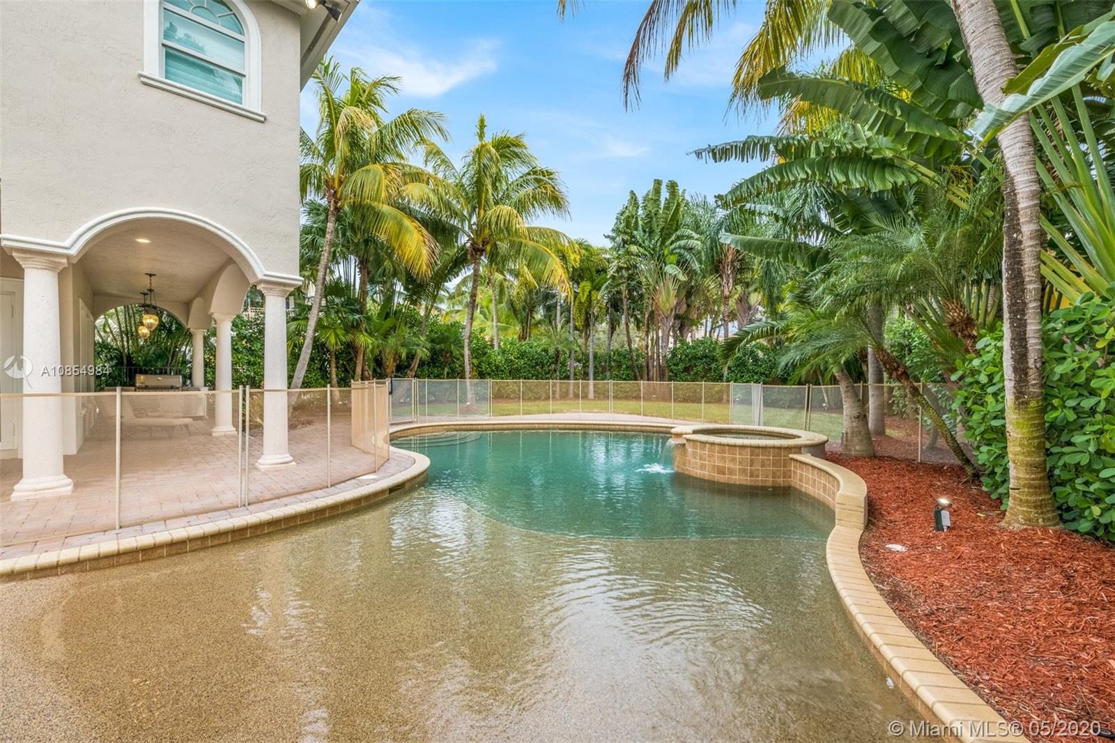 1475 Commodore Way Hollywood, FL 33019 - Photo 38 of 49 a view of a swimming pool with a patio