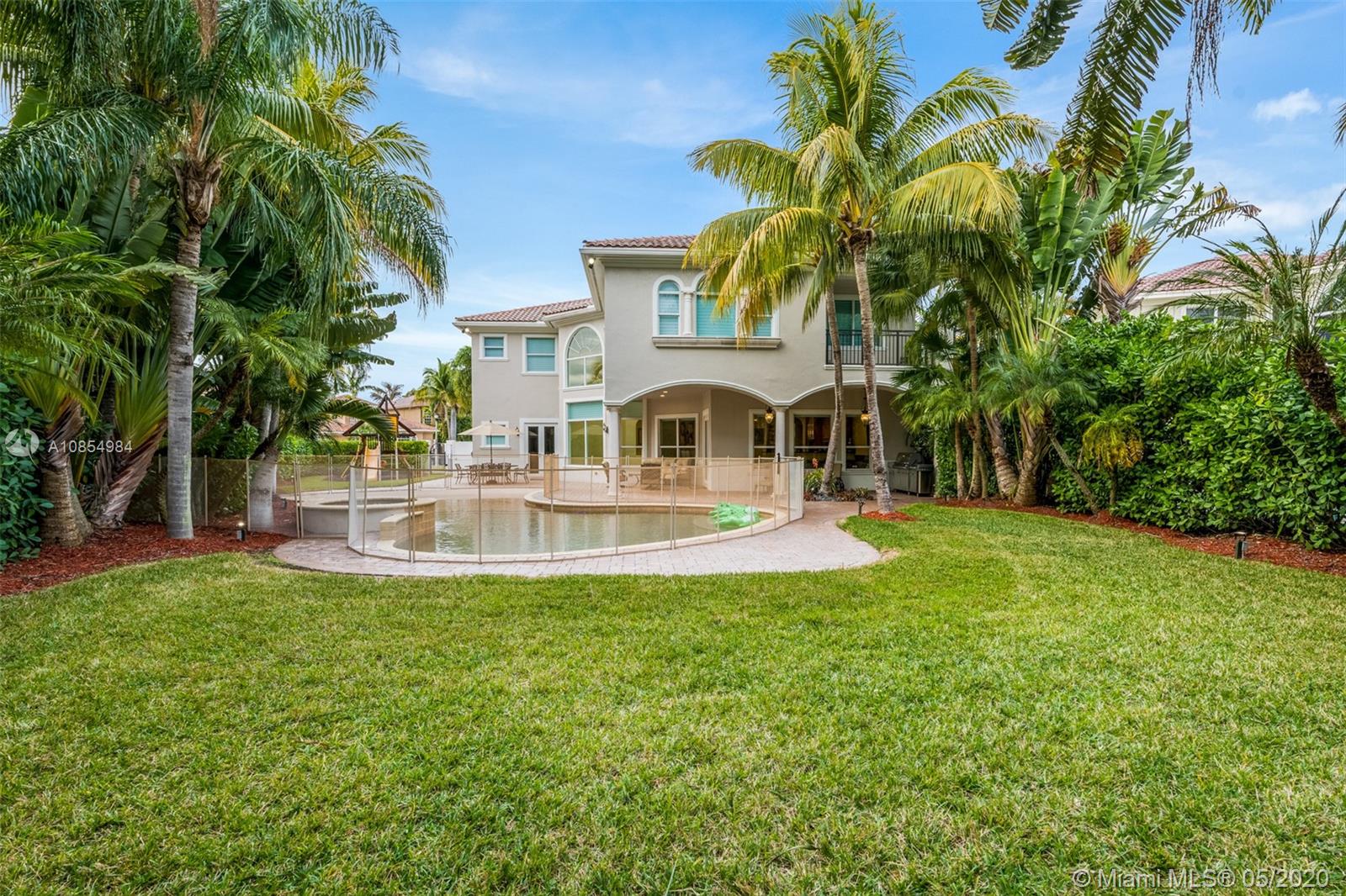 1475 Commodore Way Hollywood, FL 33019 - Photo 40 of 49 a view of a house with a swimming pool