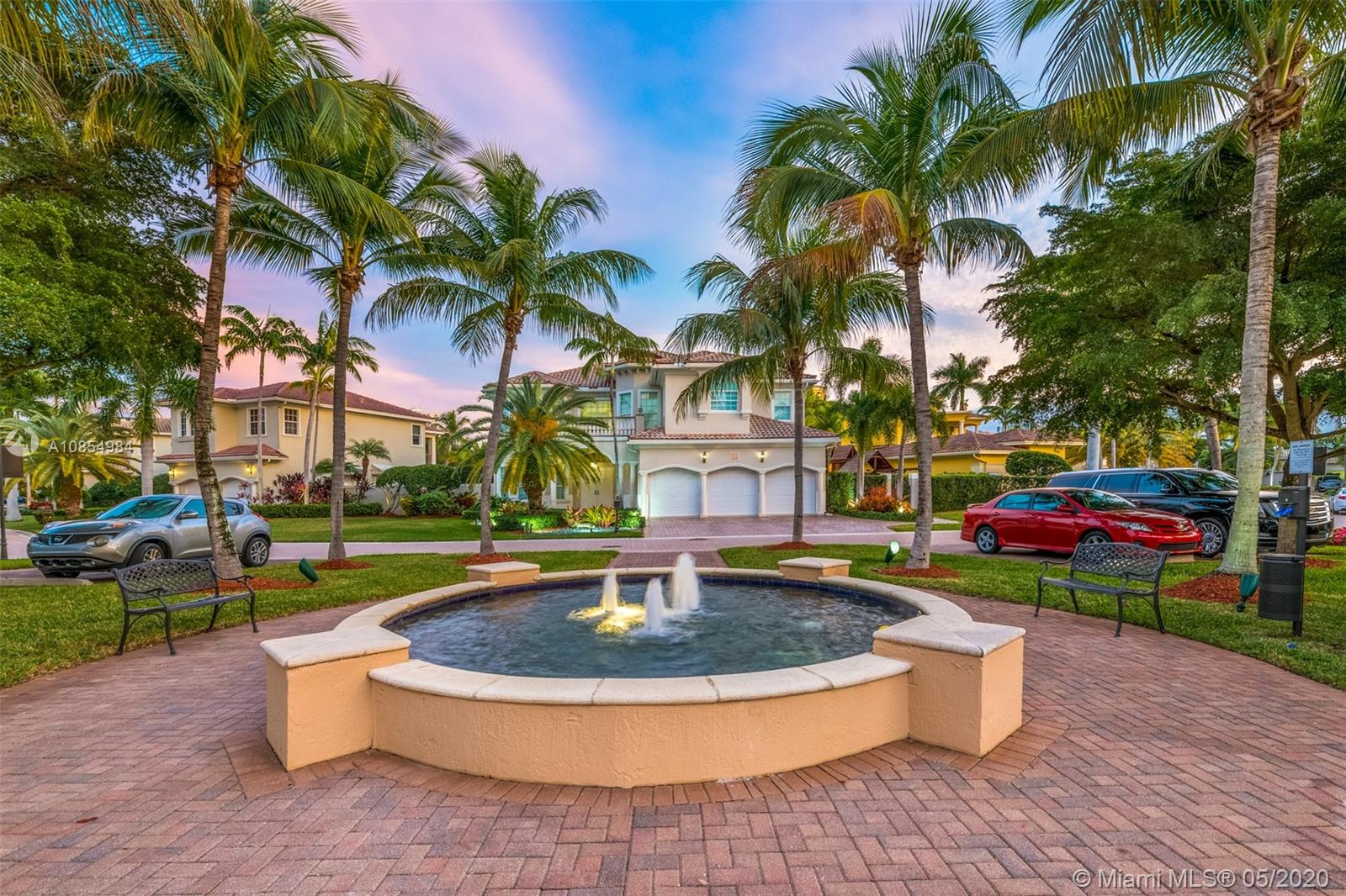 1475 Commodore Way Hollywood, FL 33019 - Photo 42 of 49 a view of a fountain in front of a house