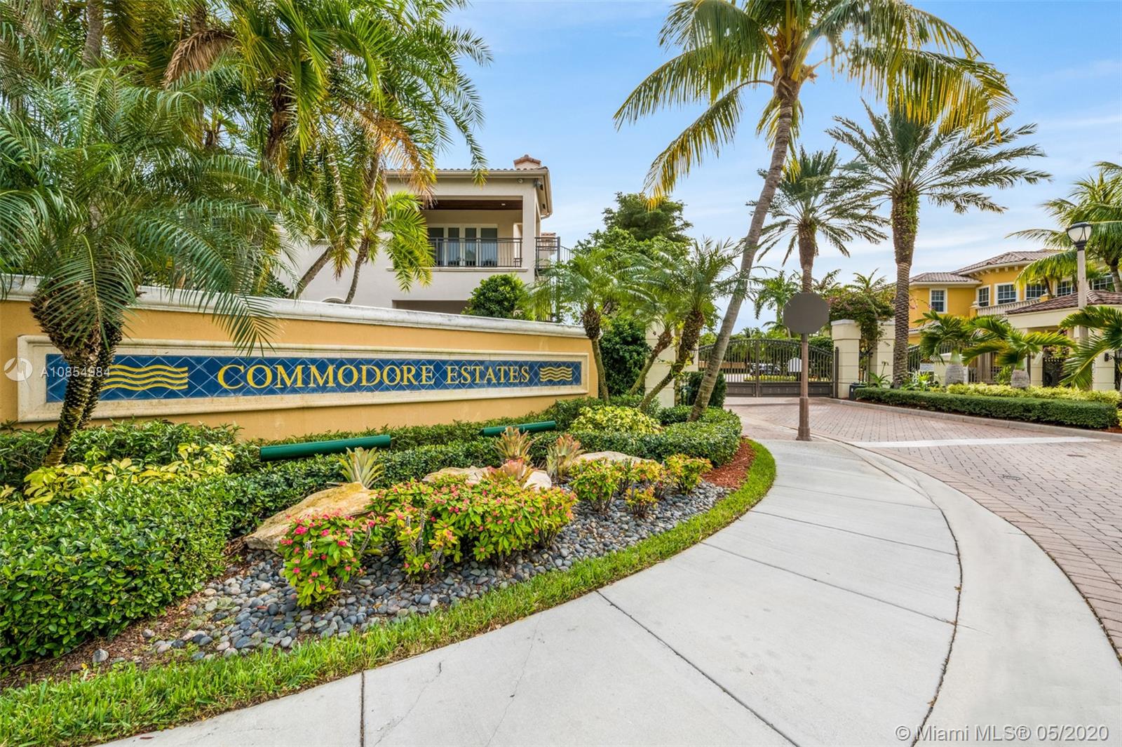 1475 Commodore Way Hollywood, FL 33019 - Photo 44 of 49 a view of a sign board with flower garden