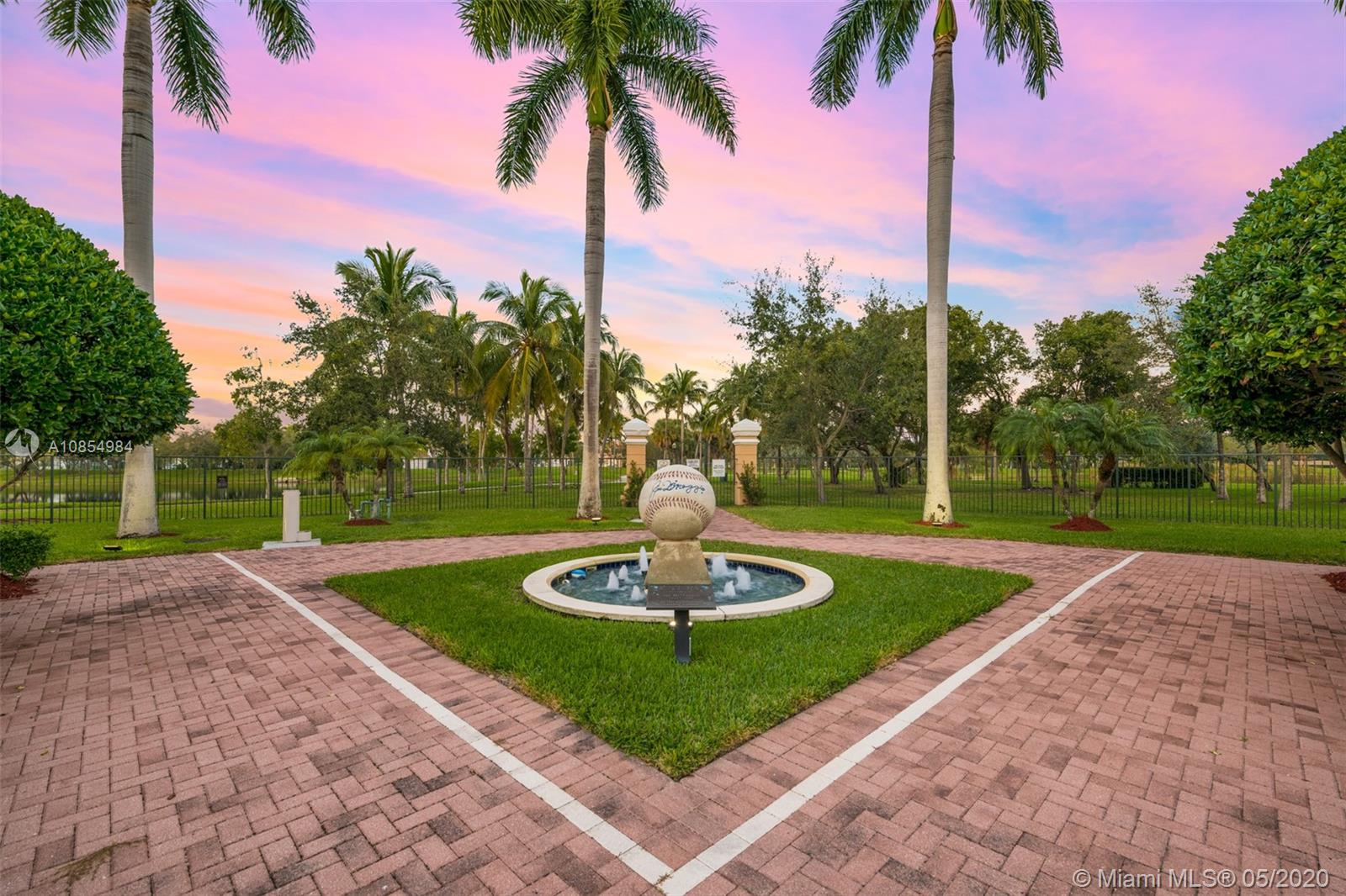 1475 Commodore Way Hollywood, FL 33019 - Photo 46 of 49 a view of a garden with a fountain