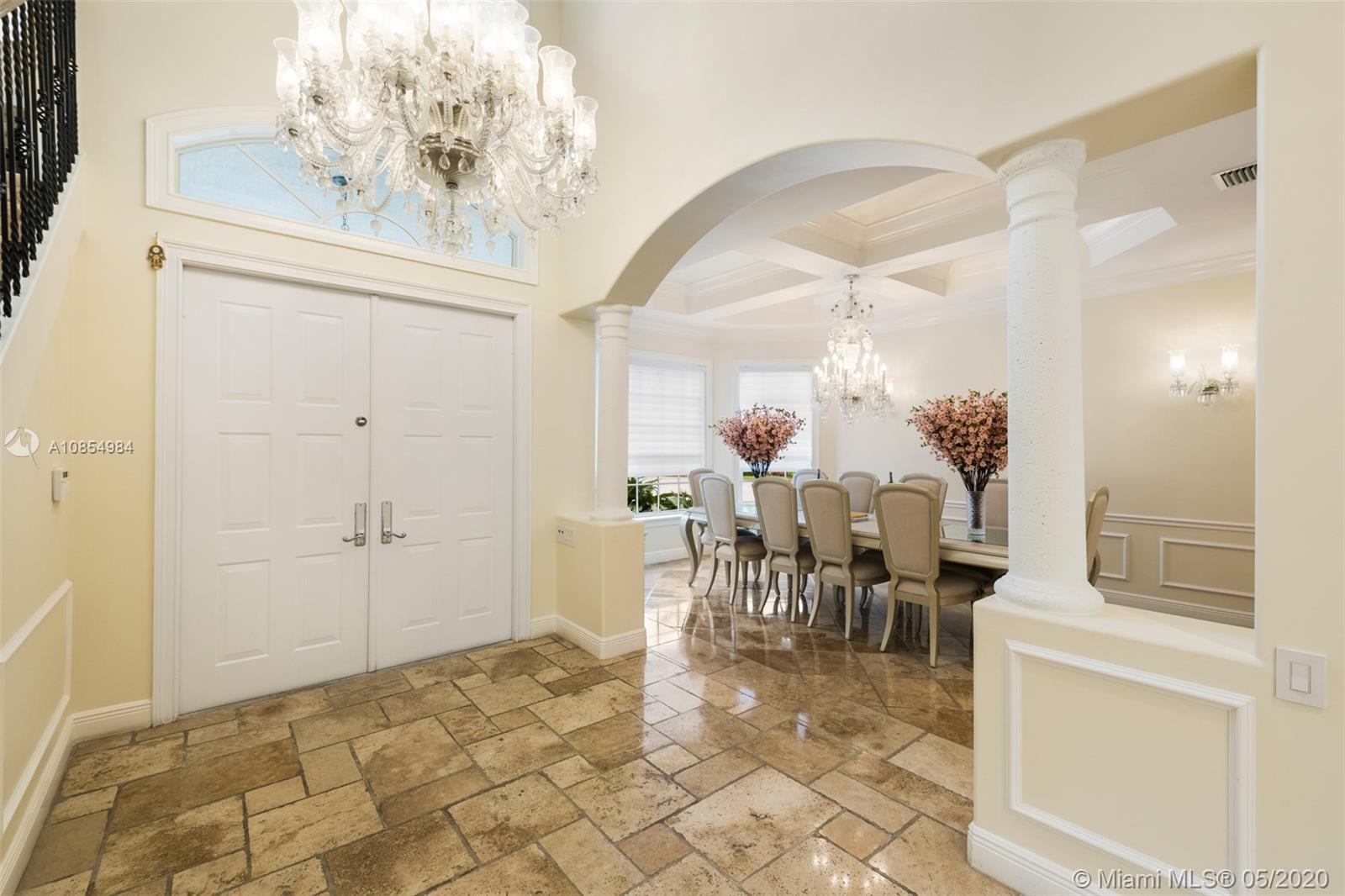 1475 Commodore Way Hollywood, FL 33019 - Photo 7 of 49 a view of a dining room with furniture and chandelier