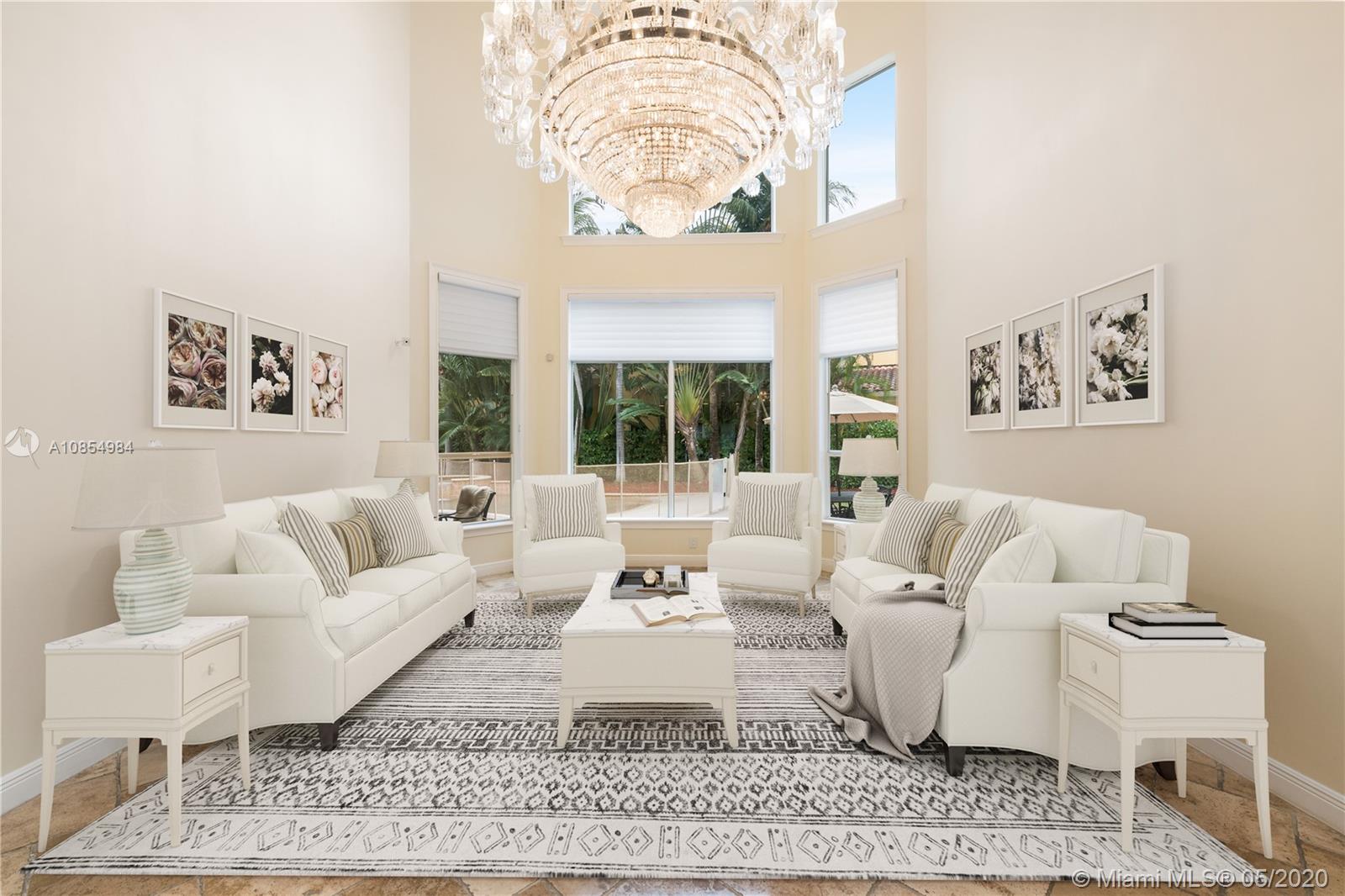 1475 Commodore Way Hollywood, FL 33019 - Photo 9 of 49 a living room with furniture and a rug