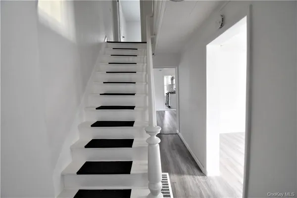 a view of entryway with wooden floor