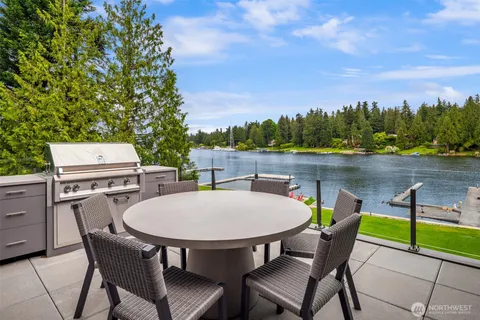 a view of a patio with a table and chairs