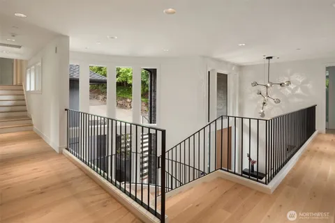 a bedroom with a large bed and a large window