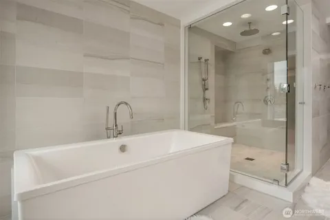 a bathroom with a double vanity sink and mirror