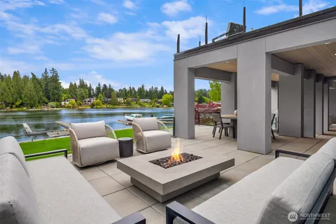a dining room with furniture and a garden view