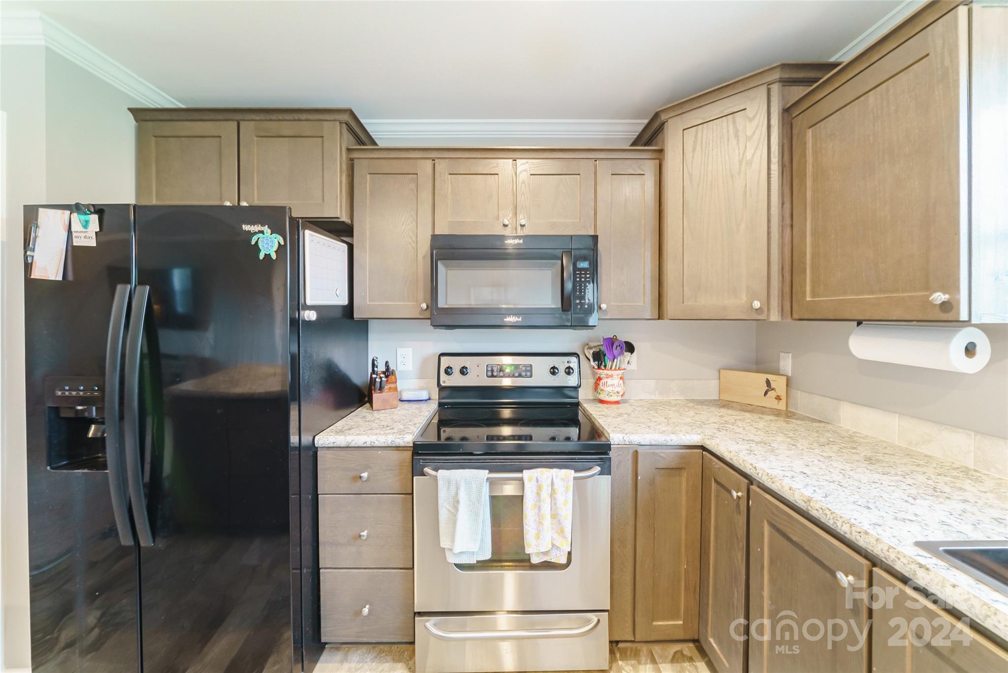 9405 Smith Road Kannapolis, NC 28081 - Photo 16 of 35 a kitchen with a stove microwave and refrigerator