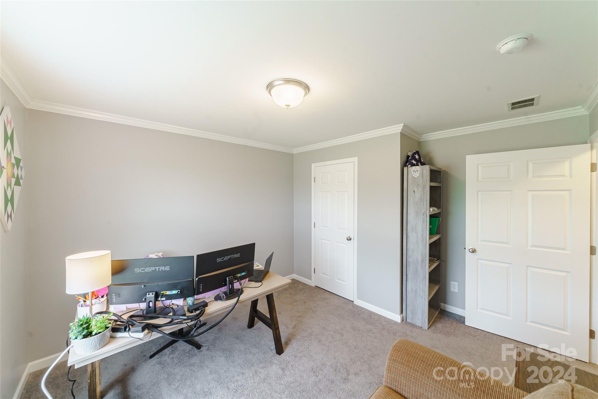 9405 Smith Road Kannapolis, NC 28081 - Photo 28 of 35 a livingroom with workspace and a couch