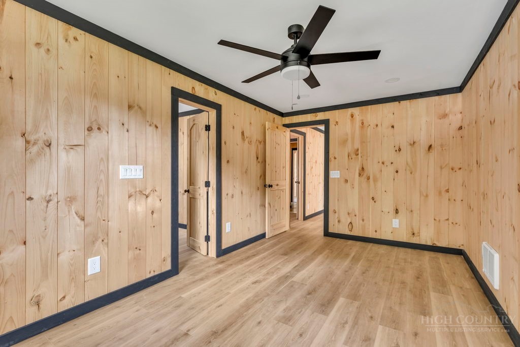 209 Meadow Loop Newland, NC 28657 - Photo 18 of 30 a view of a hallway with wooden floor and staircase