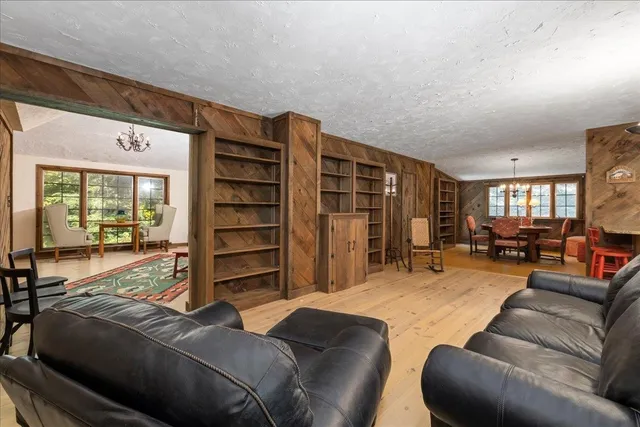 a living room with furniture and a closet
