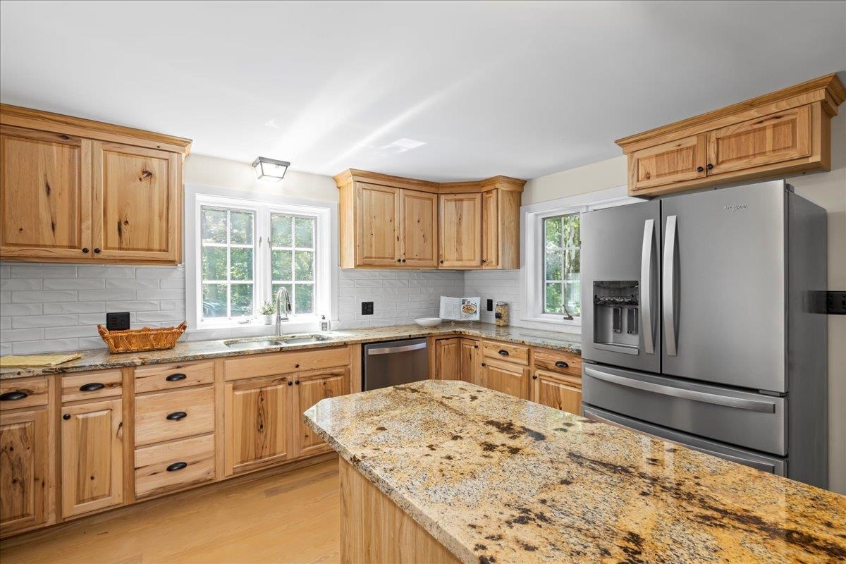 6614 Middlebrook Road Raphine, VA 24472 - Photo 24 of 52 a kitchen with granite countertop a refrigerator sink stove and cabinets