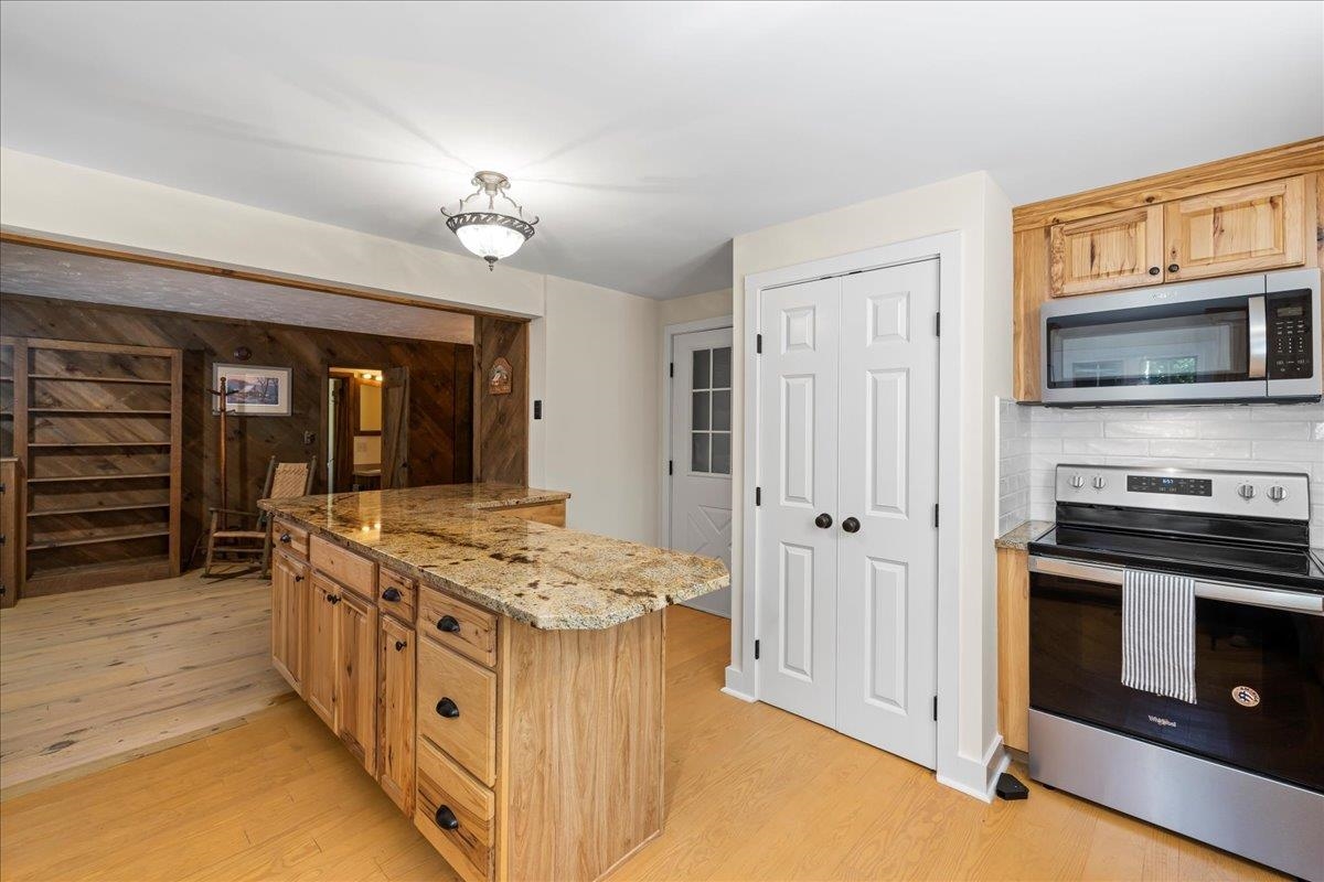 6614 Middlebrook Road Raphine, VA 24472 - Photo 29 of 52 a kitchen with stainless steel appliances granite countertop a stove and a sink