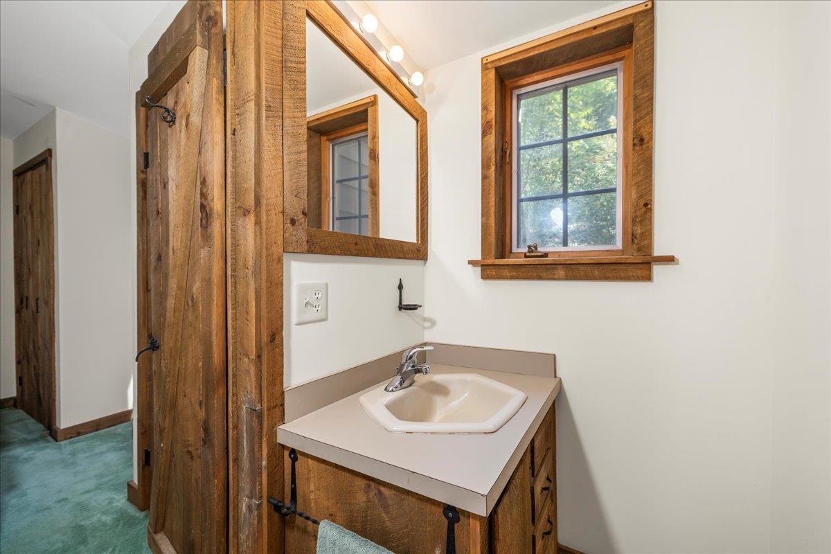6614 Middlebrook Road Raphine, VA 24472 - Photo 33 of 52 a bathroom with a sink and a mirror