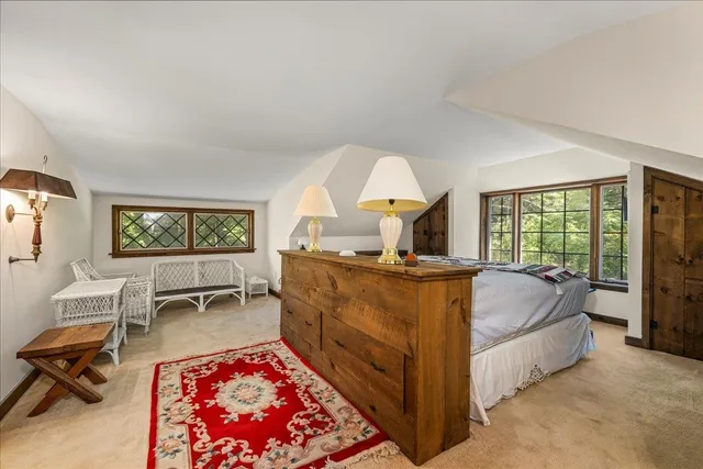 a view of a livingroom with furniture and a window