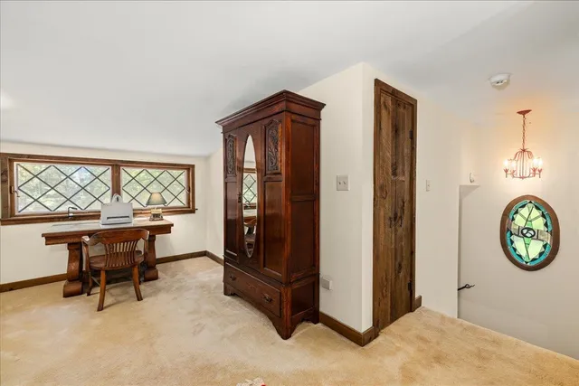 a bathroom with a sink toilet and mirror