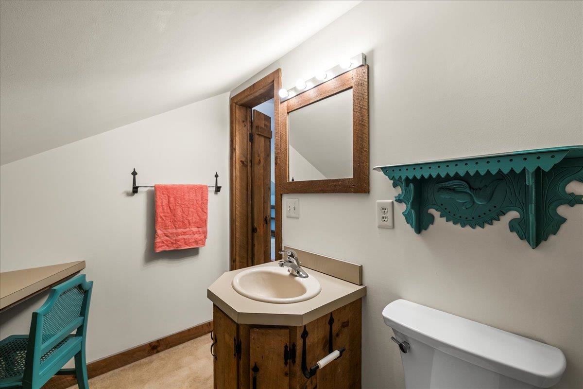 6614 Middlebrook Road Raphine, VA 24472 - Photo 36 of 52 a bathroom with a sink toilet and mirror