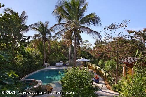 6195 North Ocean Boulevard Ocean Ridge, FL 33435 - Photo 2 of 12 a view of backyard with outdoor seating and trees