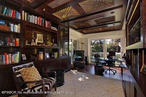 6195 North Ocean Boulevard Ocean Ridge, FL 33435 - Photo 11 of 12 a living room with furniture a book shelf and a book shelf