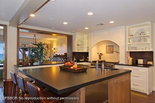 6195 North Ocean Boulevard Ocean Ridge, FL 33435 - Photo 5 of 12 a kitchen with a sink appliances and cabinets