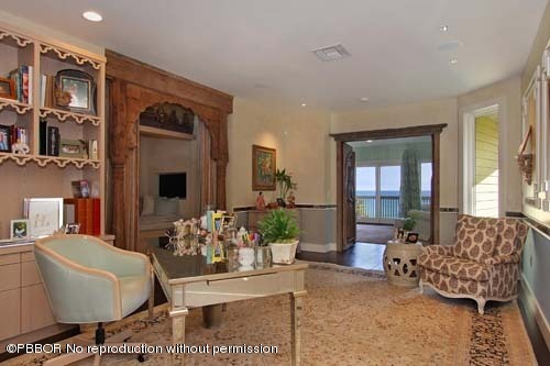 6195 North Ocean Boulevard Ocean Ridge, FL 33435 - Photo 8 of 12 a living room with furniture fireplace and a large window