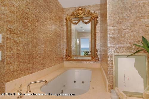 6195 North Ocean Boulevard Ocean Ridge, FL 33435 - Photo 10 of 12 a bathroom with a bathtub